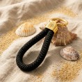 Schwarzgold – Eleganter Schlüsselanhänger im maritimen Stil